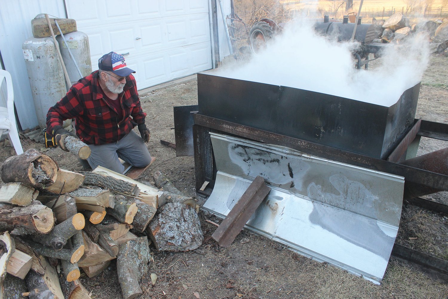 Allen Marrocco keeps the fire going as he cooks his sap with the goal of it eventually becoming maple syrup. He says the key is gathering sap and boiling it down with a focus on temperatures.